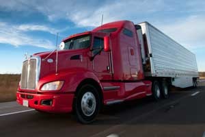 semi-300x200 Red semi pulling white trailer. Learn how to become a truck driver.