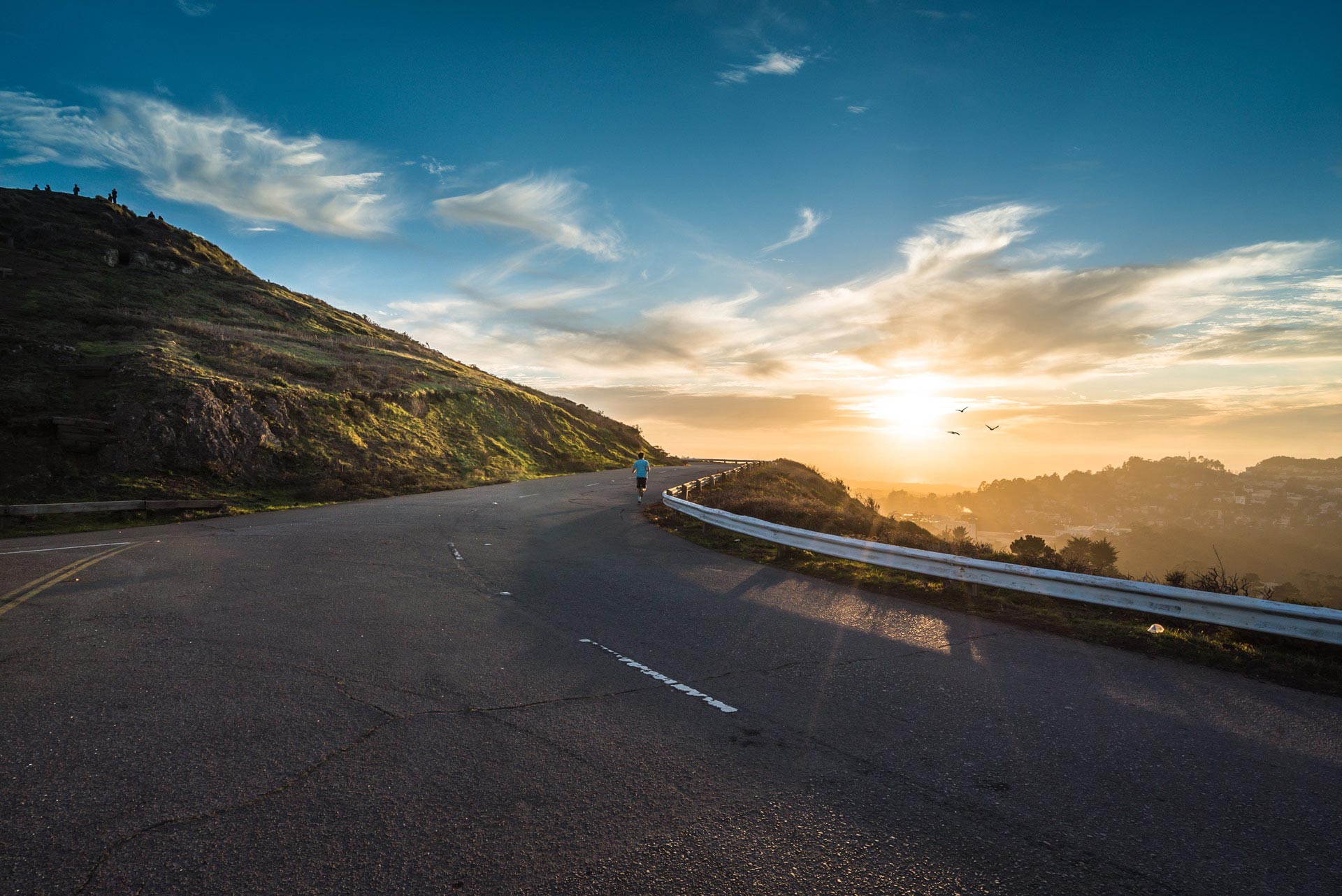 A person running along a road